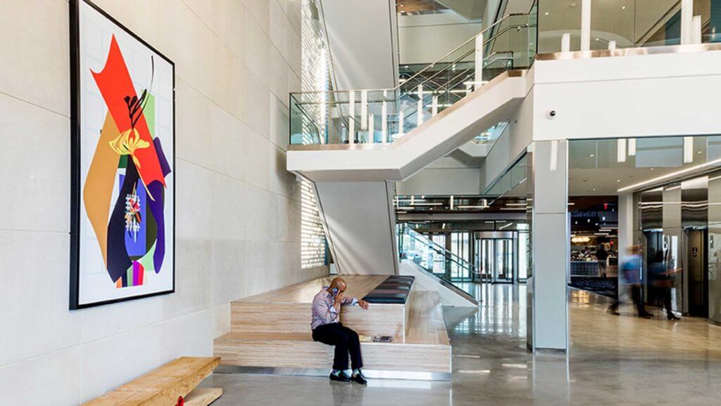 A man takes a phone call in the Capitol One building lobby in Texas
