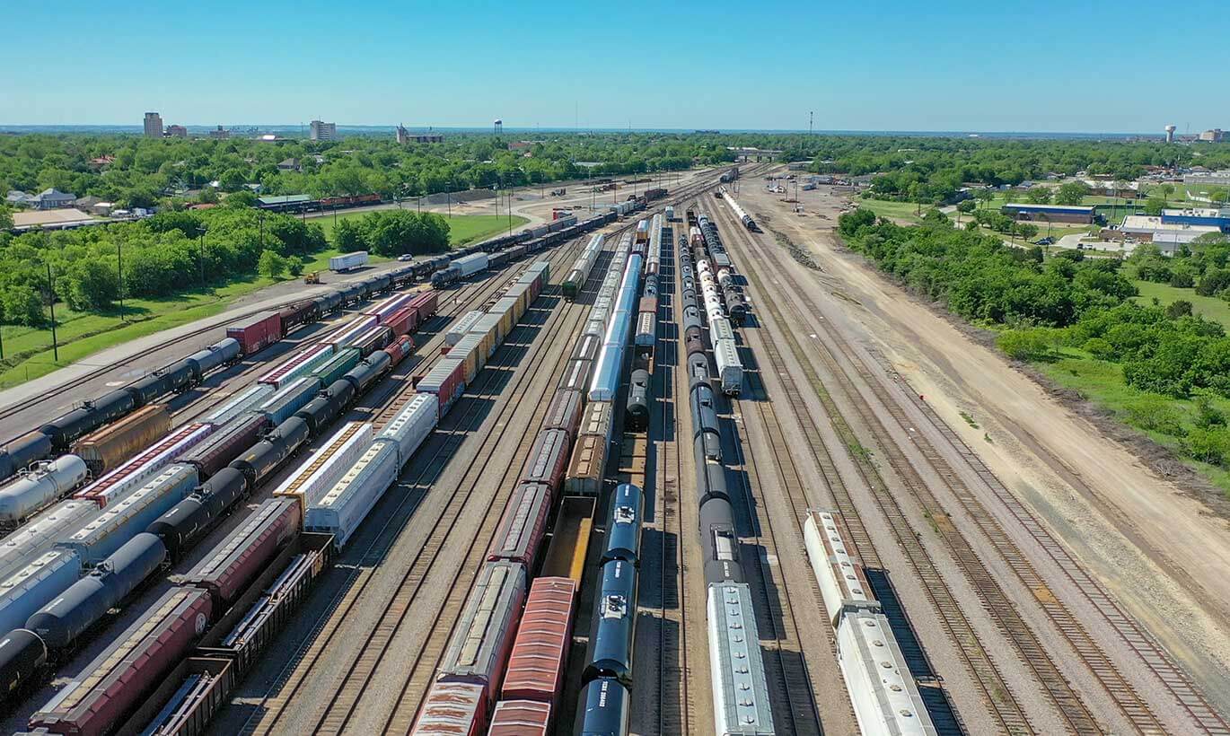 An aerial view of cargo trains lining the railway in Temple, Texas.