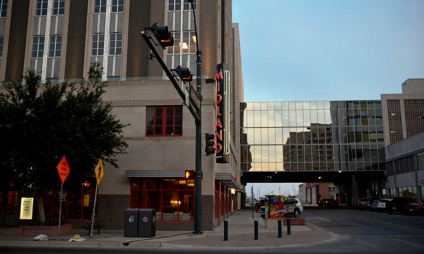 Downtown Midland features a large neon sign that says 