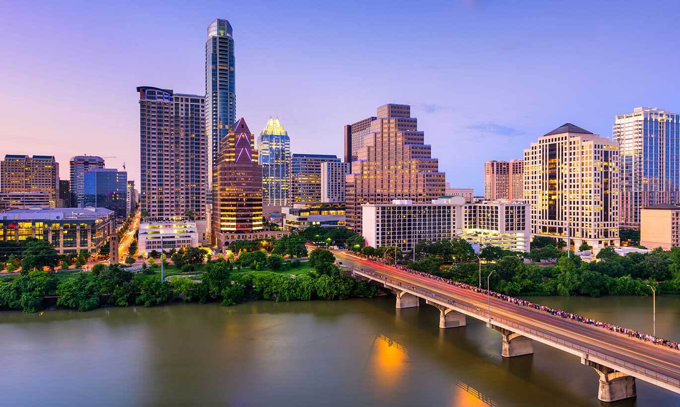 The Austin, Texas skyline lit up during sunset.