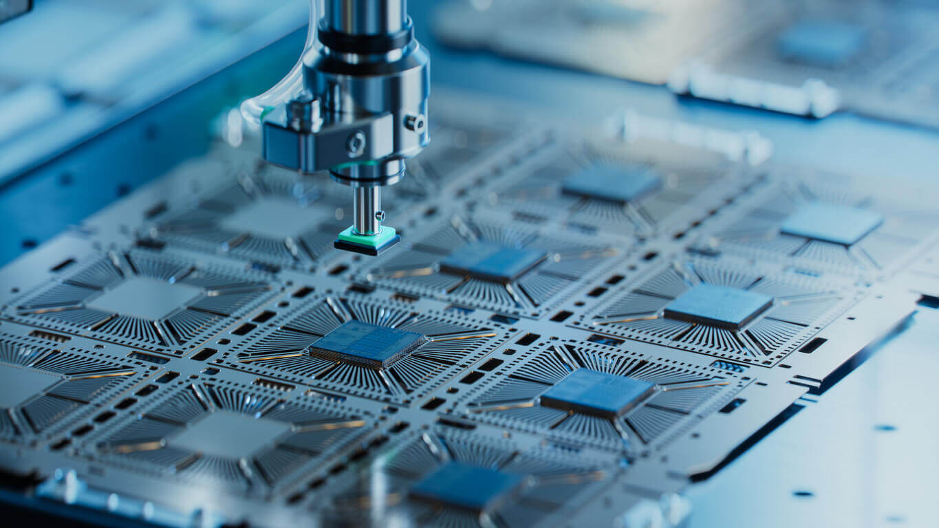 silicon dye being extracted from a semiconductor wafer at a chip manufacturing plant in Texas